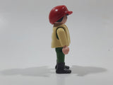 1992 Geobra Playmobil Boy with Black Hair Red Cap in Cream Vest and Green Top and Green Pants 2 1/8" Tall Toy Figure