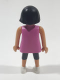 2010 Geobra Playmobil Woman with Black Hair Pink Tank Top and Dark Grey Capri Pants 3" Tall Toy Figure