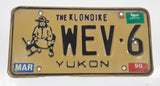 1989 1990 Yukon The Klondike Man Panning Gold Themed Yellow Metal Vehicle License Plate Tag WEV 6