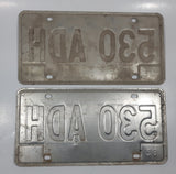 Set of 2 1985 Friendly Manitoba White With Black and Red Letters Metal Vehicle License Plate Tag 530 ADH
