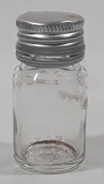 Vintage T-22 2 1/2" Tall Clear Glass Medicine Bottle with Metal Lid