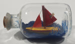 Vintage Red and Yellow Sail Boat Miniature Ship in Cork Top 3 3/8" Long Glass Bottle