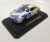 Burago Porsche 911 Carrera Racing #1 Pirelli Mobil White 1/24 Scale Die Cast Toy Car Vehicle with Opening Doors and Rear Hood on Base