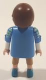 2012 Geobra Playmobil Man in Blue and Green Top with Tan Pants 2 3/4" Tall Toy Figure