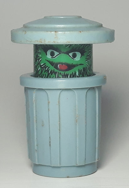 Vintage Muppets Inc Sesame Street Oscar The Grouch in Twist Pop Garbage Can 1 1/2" Tall Toy Figure
